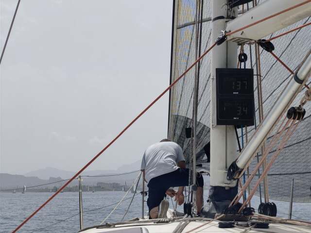 Transfer crew working on deck under sail – SailorOne