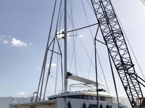 Sailing catamaran lifted by crane during haul-out in Palermo – SailorOne
