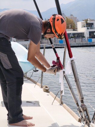 Rigger tuning standing rigging on deck – SailorOne