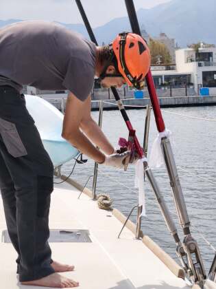Rigger tuning standing rigging on deck – SailorOne
