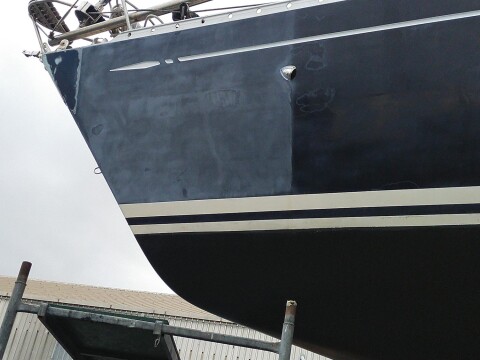 Freshly painted dark blue topsides of a sailing yacht – SailorOne